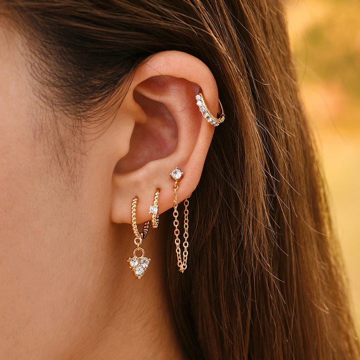 Close-up of sparkling crystal elegant dangle earrings. Women's chic jewelry.