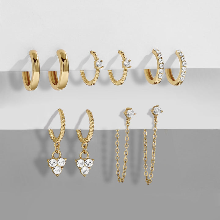 Women wearing elegant dangle earrings, enhancing her chic style. Fashion accessory.