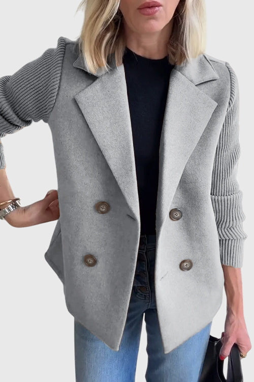 Elegant women's double-breasted tailored blazer, a chic outerwear piece for a polished business look.