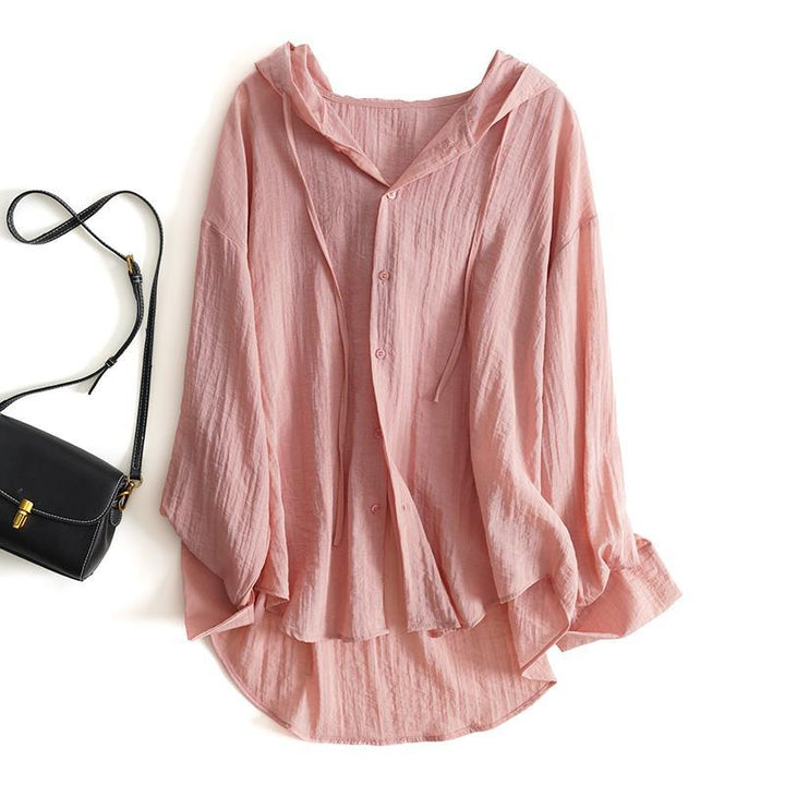Beige women's hooded blouse with elegant drape. Light, breathable, and versatile for spring/summer fashion.