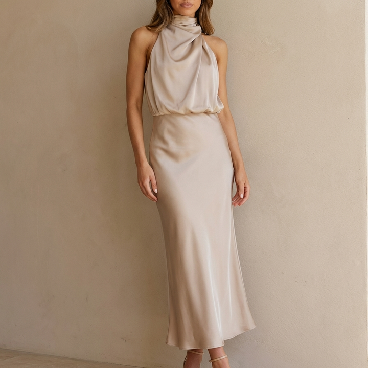 Women's elegant draped halter neck midi dress, perfect for evening wear & special occasions.
