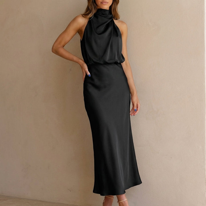 Stylish women's sleeveless midi dress featuring a draped halter neck & blouson waist for parties.