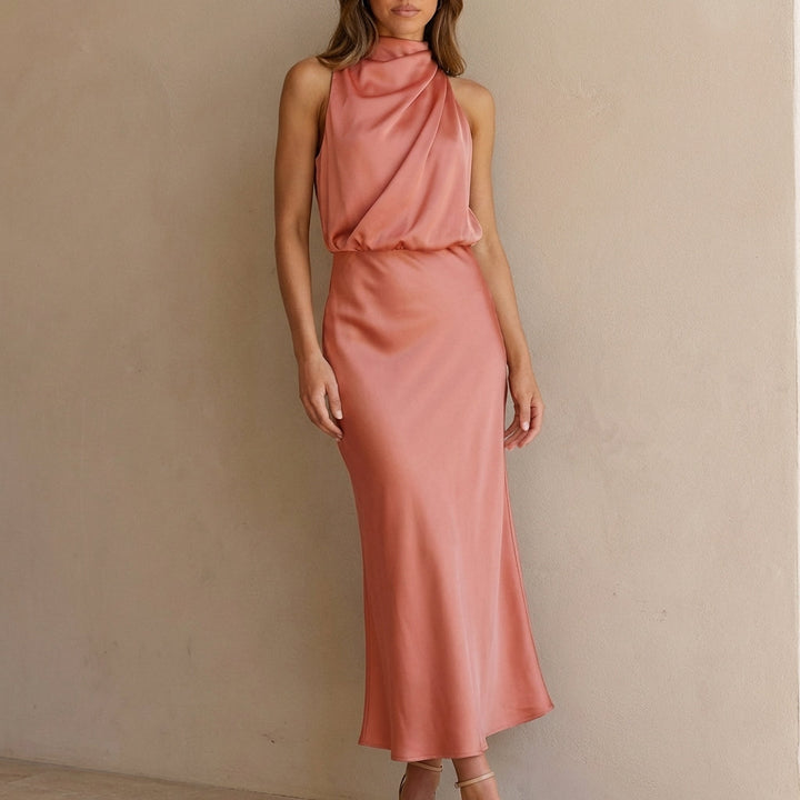 Women's draped halter neck midi dress. Sleeveless, elegant design for evening wear & formal events.