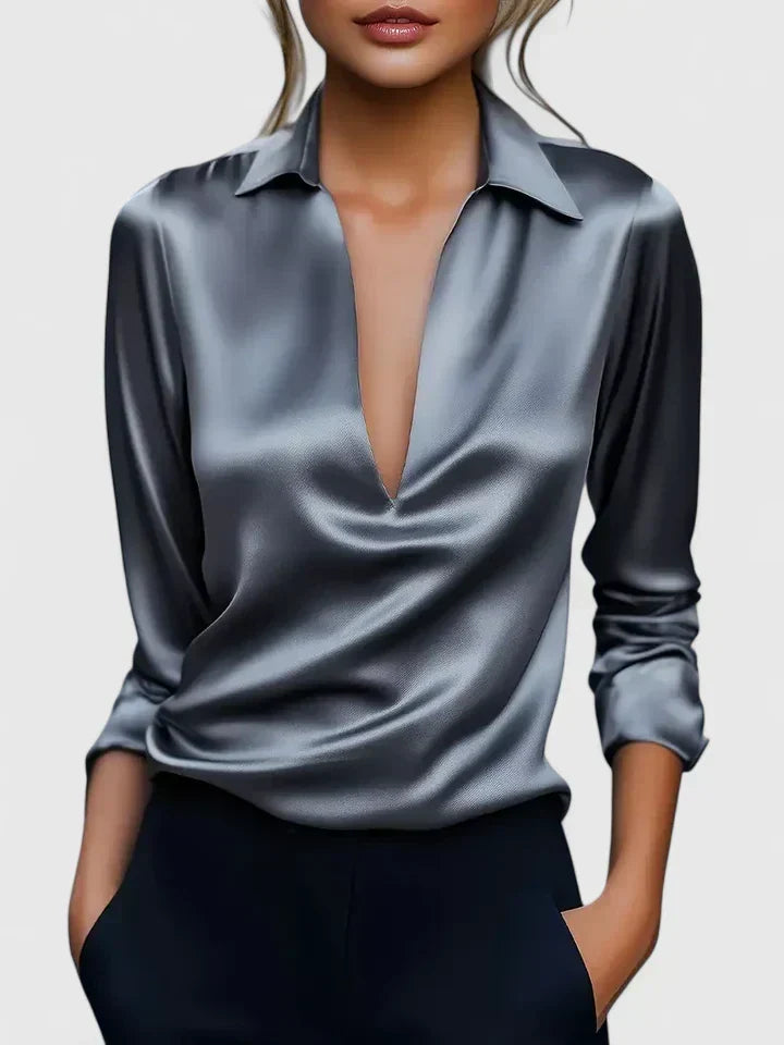 Relaxed fit women's V-neck blouse with elegant draping and long sleeves, suitable for casual chic fashion.