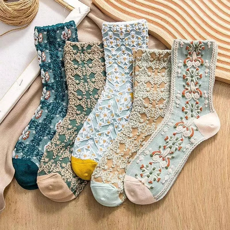 Close-up of intricate embroidery on elegant women's ankle socks. Vintage-inspired stylish footwear.