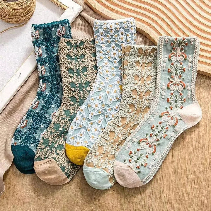 Close-up of intricate embroidery on elegant women's ankle socks. Vintage-inspired stylish footwear.