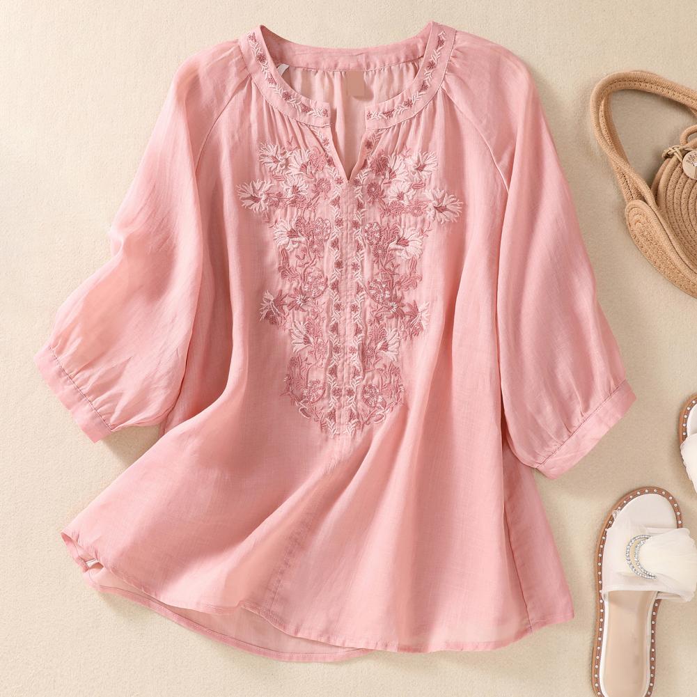 Spring/summer women's embroidered blouse with a relaxed fit & delicate floral design for comfort.