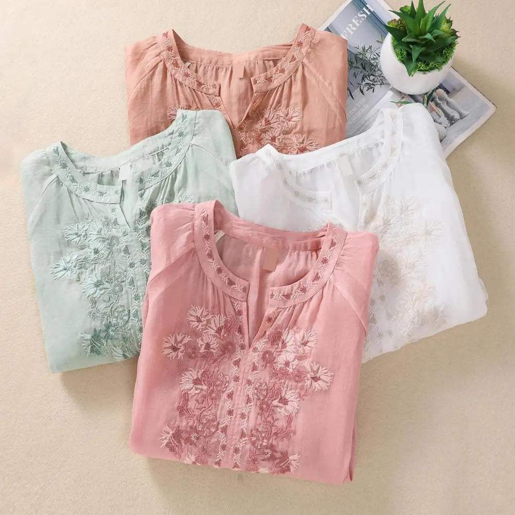 Boho chic women's blouse featuring intricate floral embroidery for an elegant and versatile look.