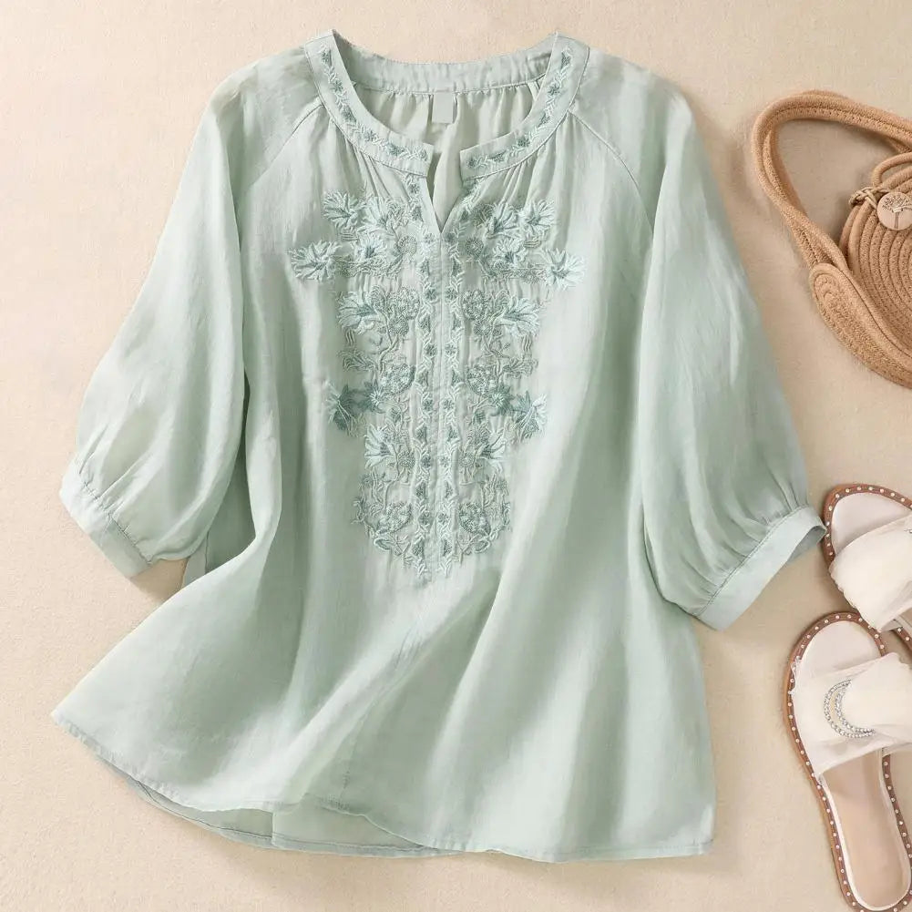 Effortless style women's lightweight blouse with delicate floral embroidery, perfect for summer.