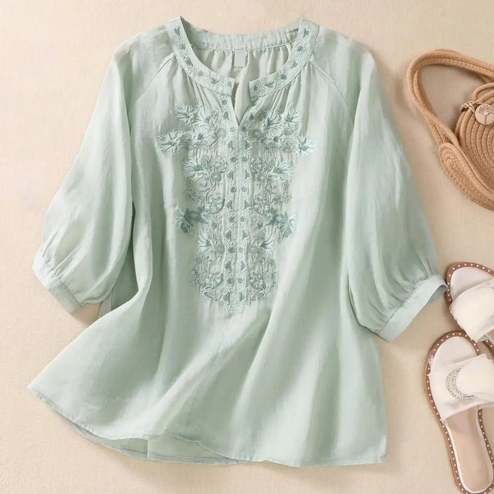 Effortless style women's lightweight blouse with delicate floral embroidery, perfect for summer.