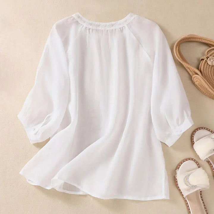 Versatile women's embroidered blouse, an elegant top with floral details for various occasions.