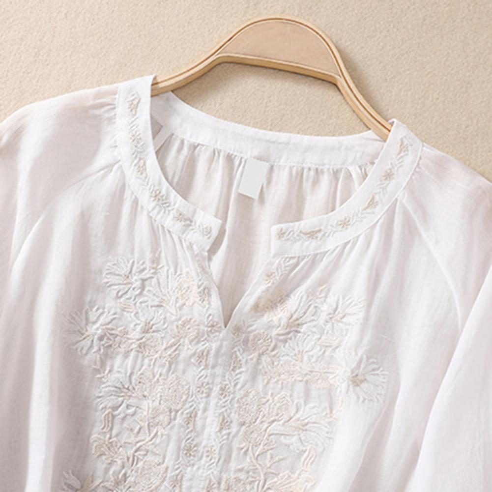 Casual yet elegant women's embroidered top, a relaxed fit blouse ideal for summer fashion.