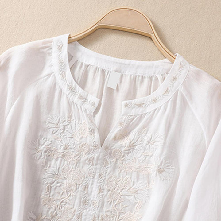 Casual yet elegant women's embroidered top, a relaxed fit blouse ideal for summer fashion.