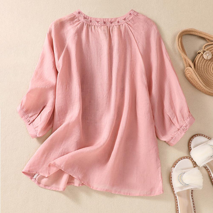 Effortless style women's embroidered blouse, a lightweight and elegant top with floral patterns.