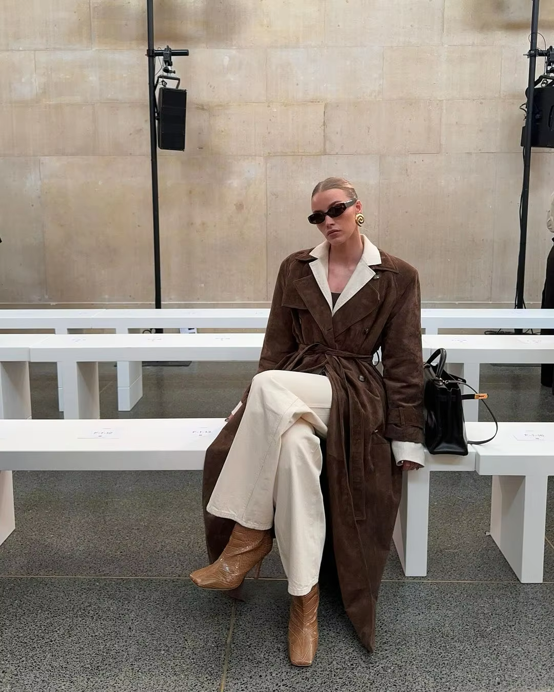 Neutral toned elegant women's faux suede winter jacket, versatile cold weather outerwear.