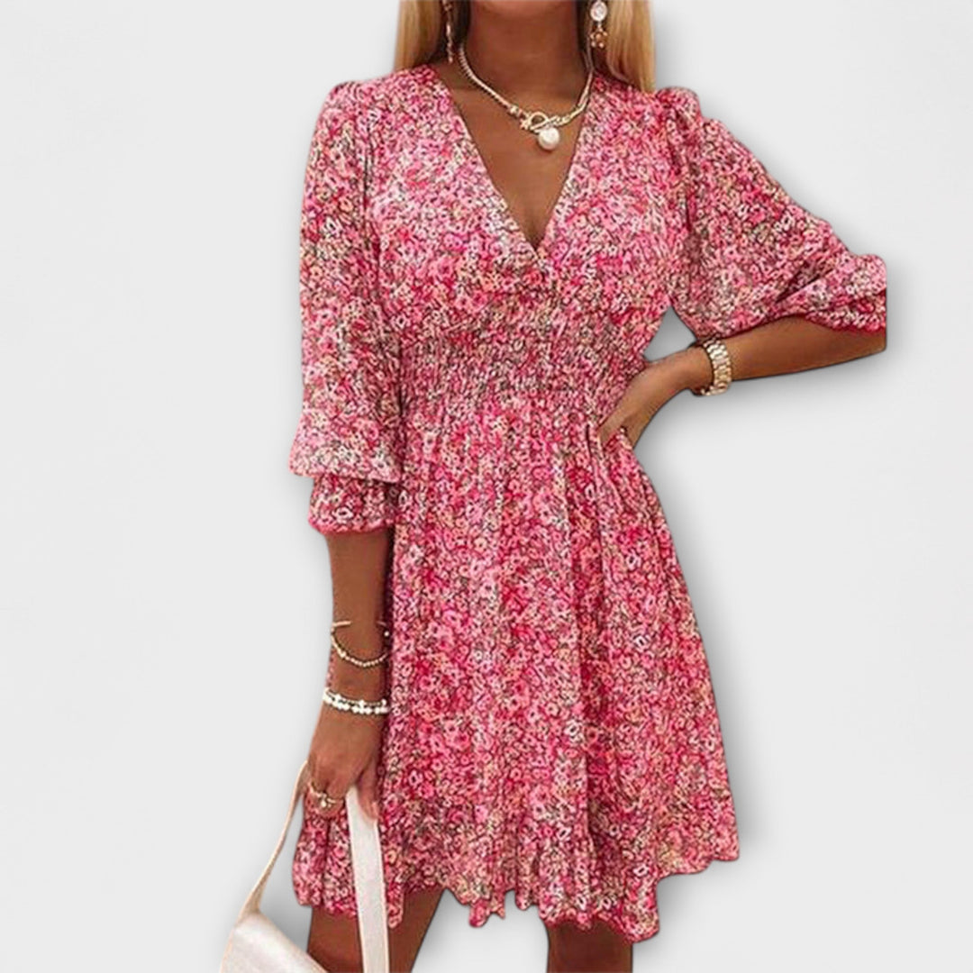 Women's elegant floral A-line midi dress with puff sleeves, perfect for summer garden parties.