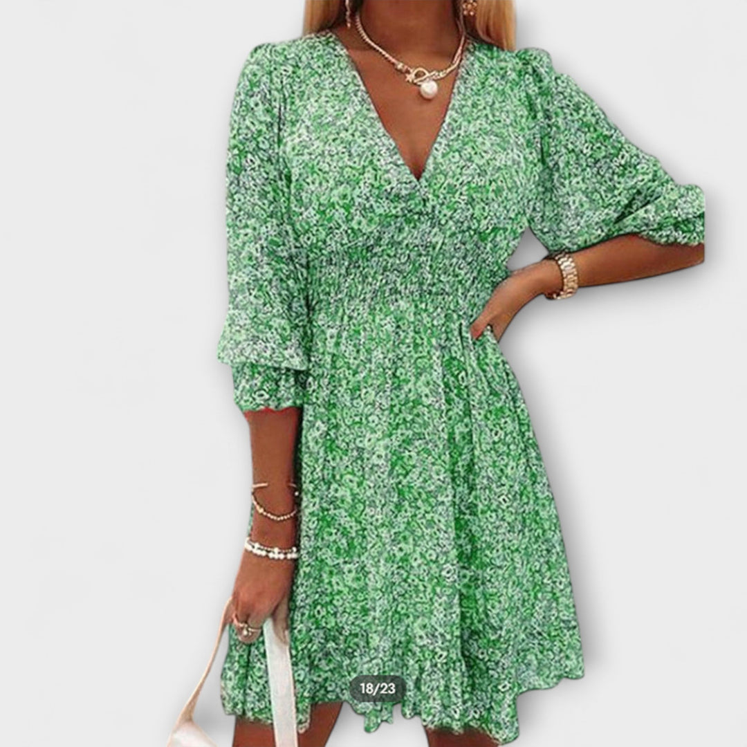 Pink floral A-line dress for women, featuring stylish puff sleeves and a flattering summer midi fit.