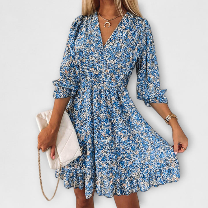 Green floral women's A-line dress with puff sleeves, a versatile and casual summer midi style.