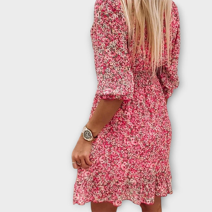 Casual women's floral A-line midi dress with comfortable puff sleeves, perfect for summer outings.