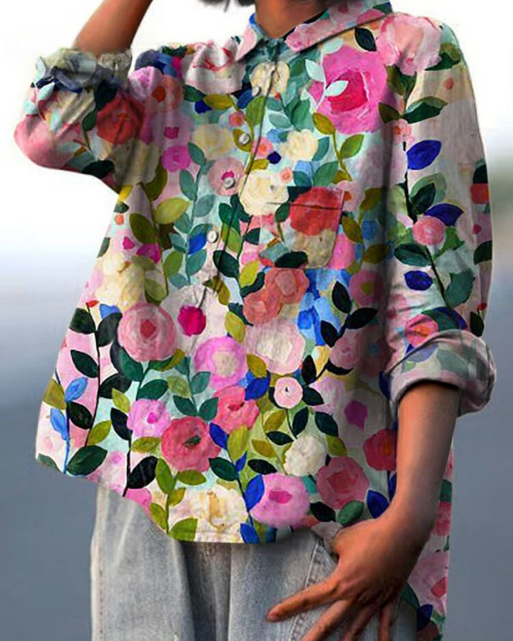 Chic women's floral top, versatile for casual or dressy looks.