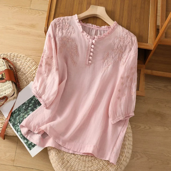 Comfortable women's floral button-front blouse, versatile for casual or stylish looks.