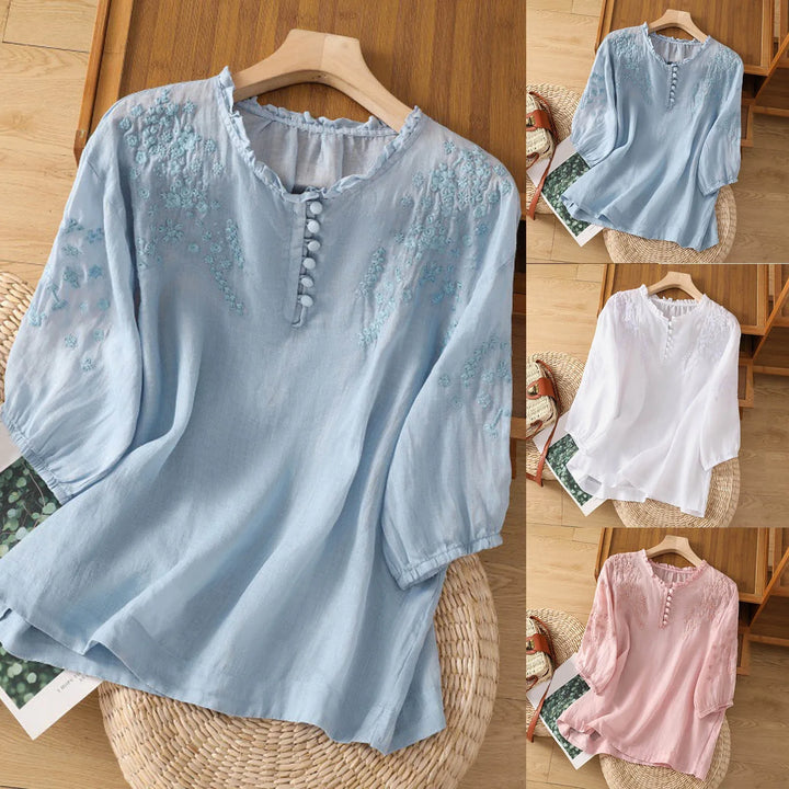 Stylish women's button-front blouse with vibrant floral print, ideal for spring fashion.