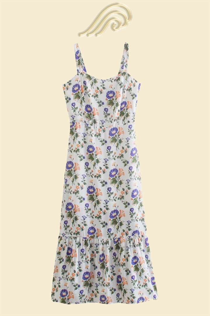 Floral flared midi vacation dress for women, with comfortable straps, perfect for sunny days.