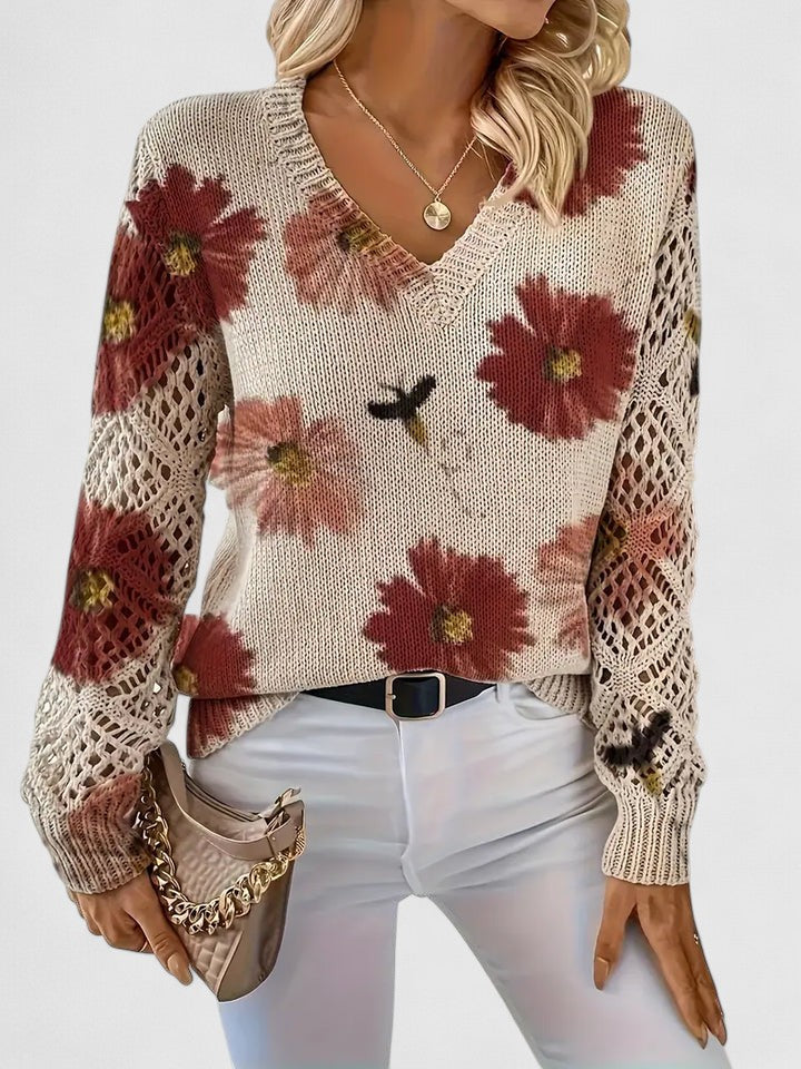 Women's v-neck knit cardigan with vibrant floral pattern; versatile for everyday fashion.