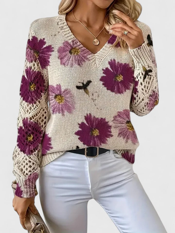 Fashion-forward women's knit cardigan with intricate floral details; perfect for a chic look.