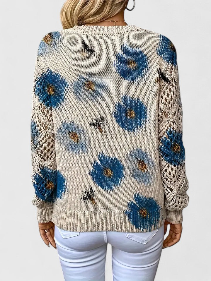 Close-up: Delicate floral pattern on an elegant women's knit long sleeve cardigan.