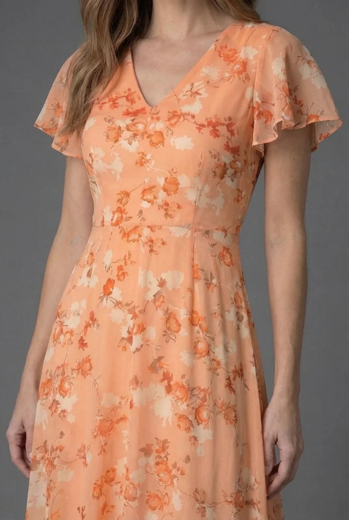 Chic floral V-neck maxi dress with flutter sleeves, ideal as a wedding guest or elegant party dress.