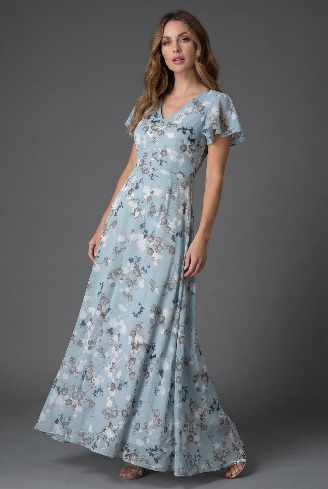 Vibrant floral print women's maxi dress featuring a V-neck & flutter sleeves, excellent for summer parties.