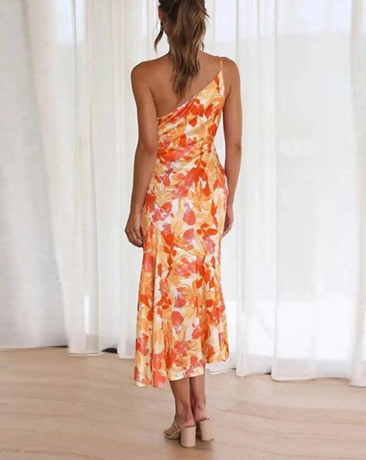 Fashionable women's floral one-shoulder midi dress, ideal as a flattering party or evening dress.