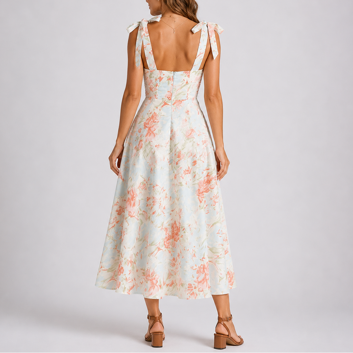 Vibrant floral print midi dress for women, featuring a comfortable ruched design and customizable adjustable straps.