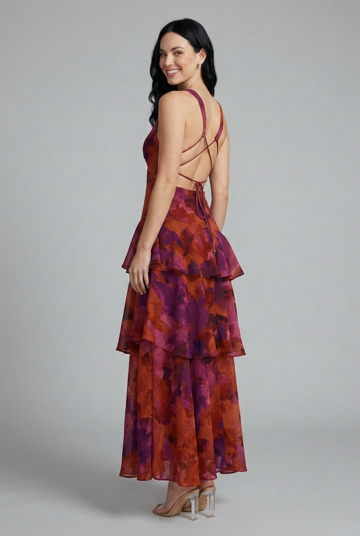 Flowy sleeveless V-neck maxi dress with beautiful floral print & tiered design, ideal for casual summer days.
