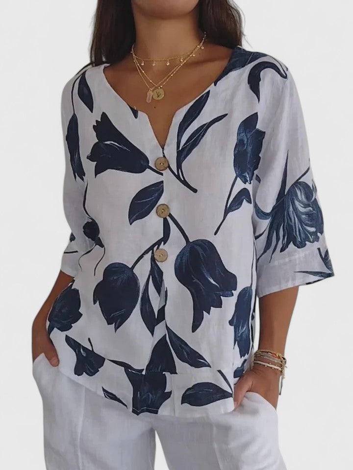 Women's elegant floral V-neck blouse, comfortable long sleeve top for stylish everyday wear.