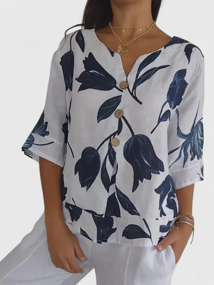 Stylish women's V-neck blouse with vibrant floral print, perfect elegant & versatile fashion top.