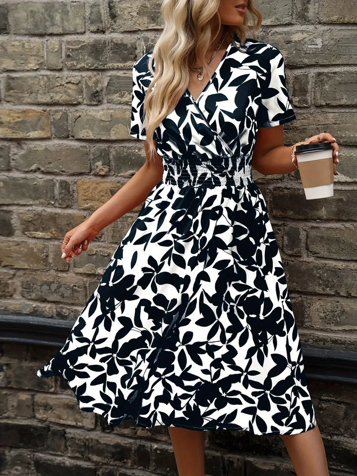 Women's elegant floral wrap midi dress, perfect for spring & summer occasions.
