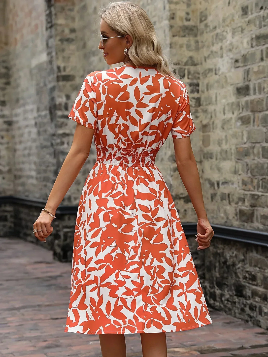 Flowy women's floral wrap midi dress, comfortable for elegant spring and summer events.