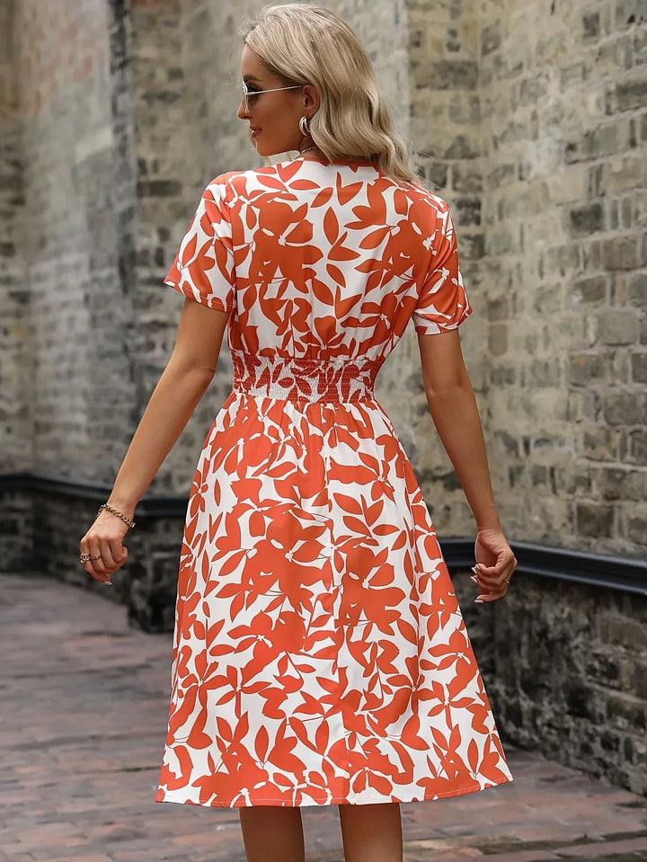 Flowy women's floral wrap midi dress, comfortable for elegant spring and summer events.