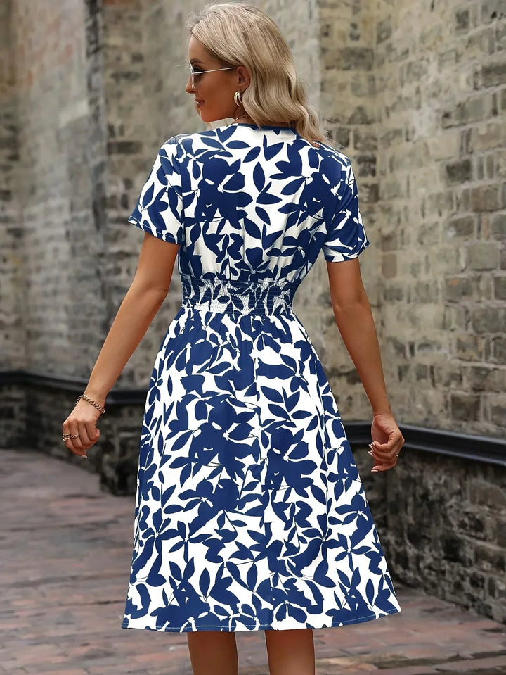 Stylish women's floral pattern wrap dress, a versatile choice for any elegant occasion.