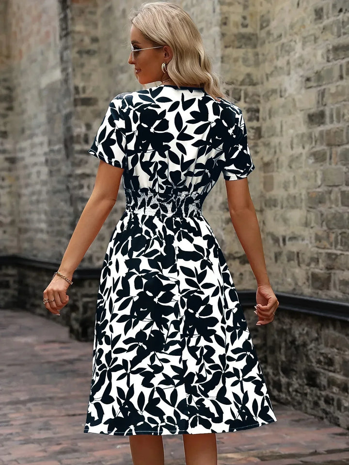 Chic women's floral wrap dress, a must-have elegant piece for spring and summer fashion.