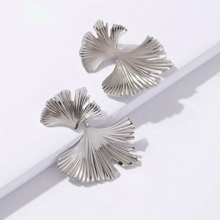 Beautiful floral dangle earrings in gold and silver for women. A perfect elegant jewelry gift for her.
