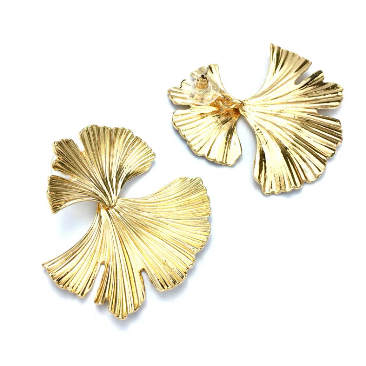 Liora women's flower dangle earrings featuring elegant gold & silver design. Sophisticated floral jewelry.