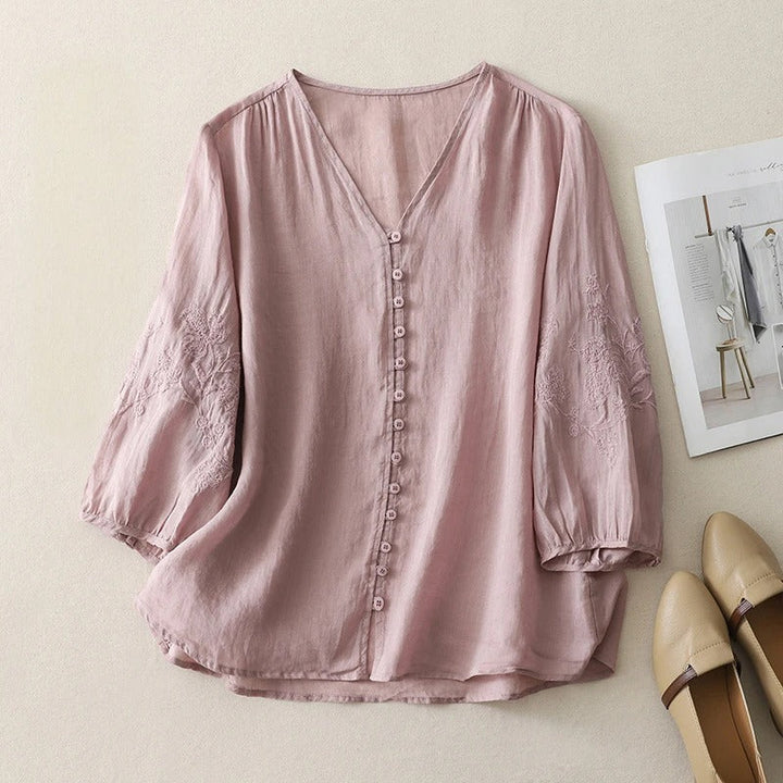 Women's elegant flowing blouse with delicate embroidery, button-down front, perfect for spring/summer casual wear.