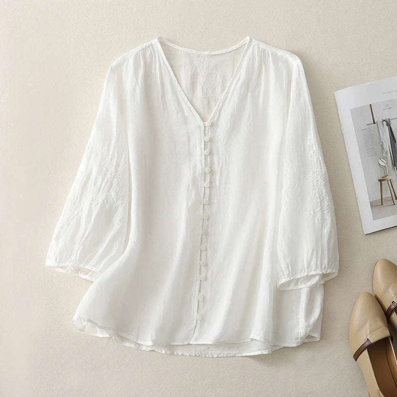 Elegant women's embroidered flowing blouse, a stylish button-down top ideal for spring and summer casual outfits.