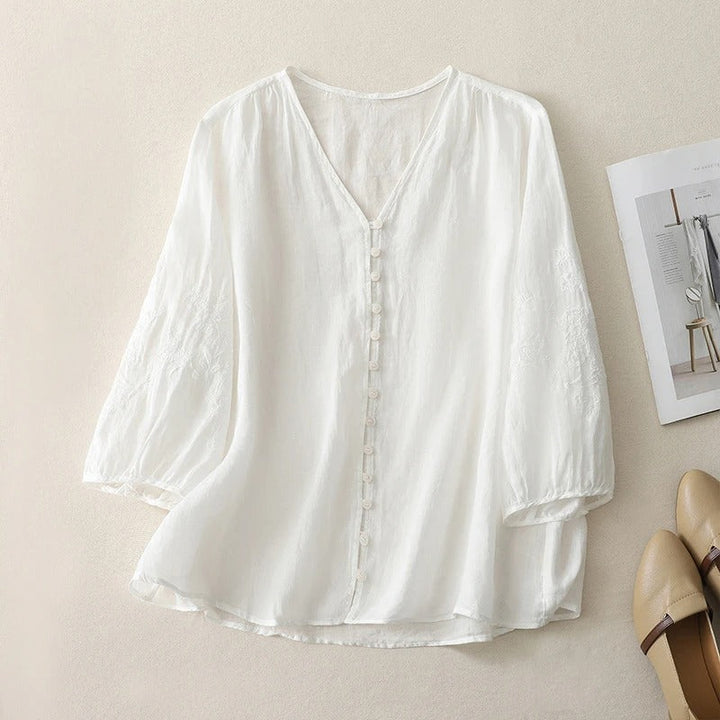 Elegant women's embroidered flowing blouse, a stylish button-down top ideal for spring and summer casual outfits.