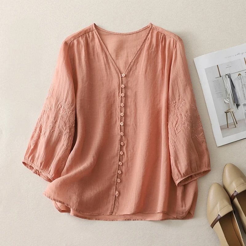 Stylish women's embroidered flowing blouse, a versatile button-down top suitable for elegant or casual spring wear.