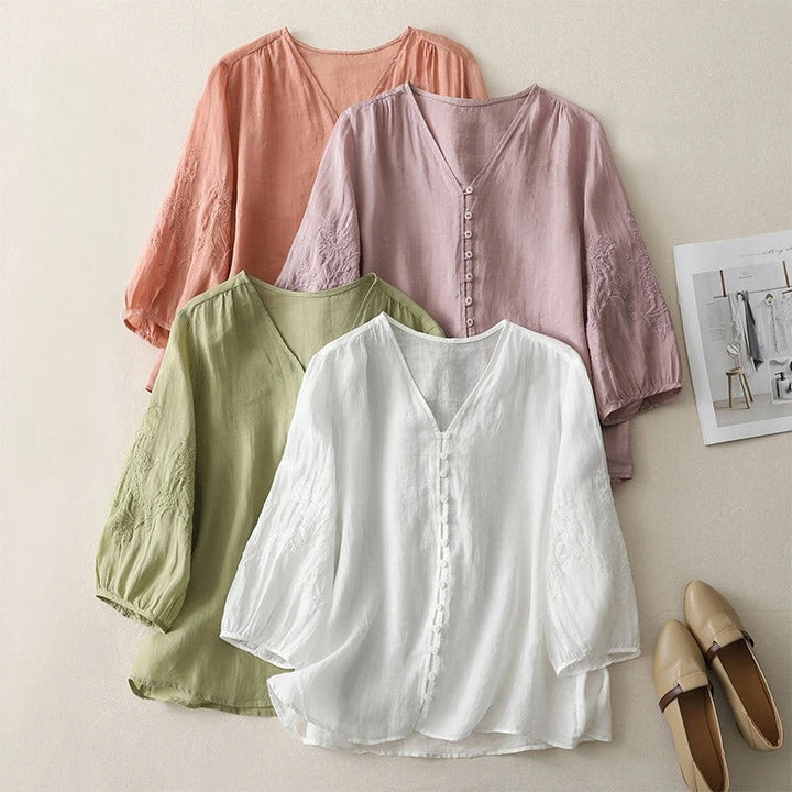 Women's elegant embroidered flowing blouse. Button-down top, perfect for casual spring and summer fashion.
