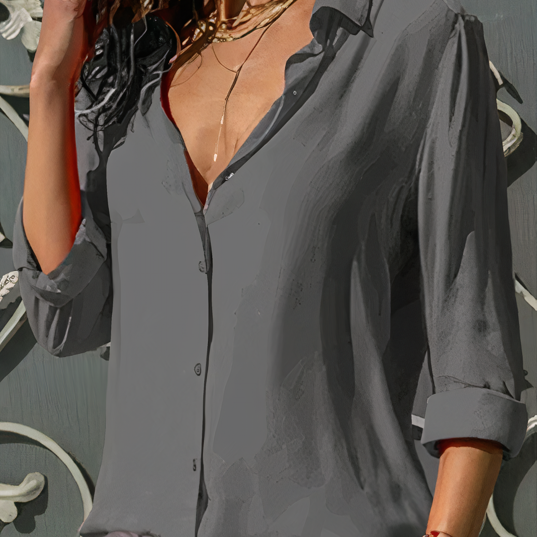 Back view of a women's elegant flowy chiffon blouse, showcasing its comfortable and stylish movement.